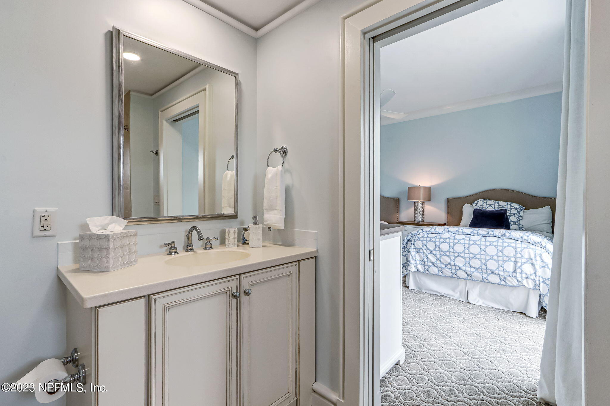 2358 Riverside Avenue, Unit 401 Jacksonville, FL 32204 - Photo 52 of 92 a bathroom with a sink and a mirror