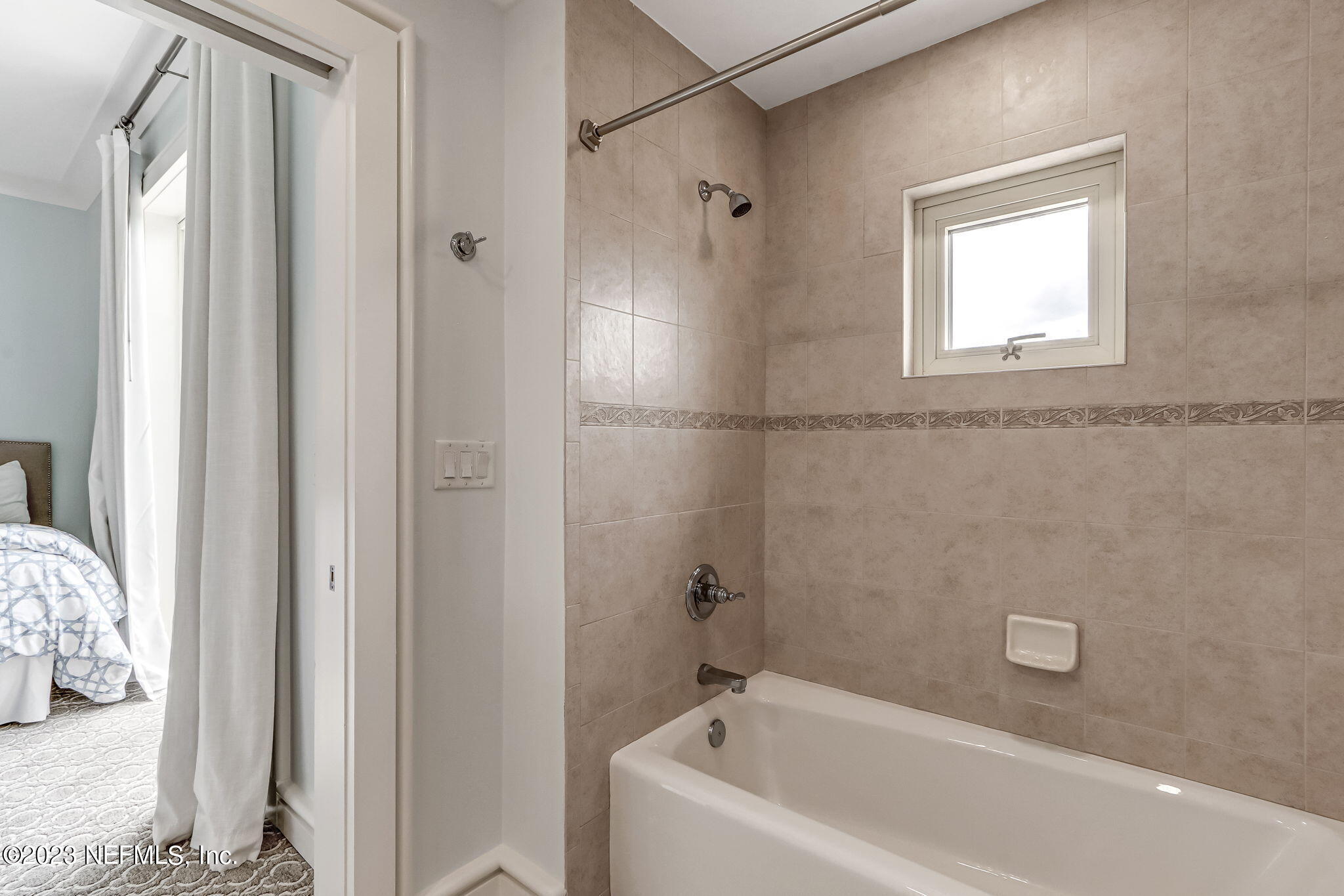 2358 Riverside Avenue, Unit 401 Jacksonville, FL 32204 - Photo 53 of 92 a bathroom with a bathtub and shower