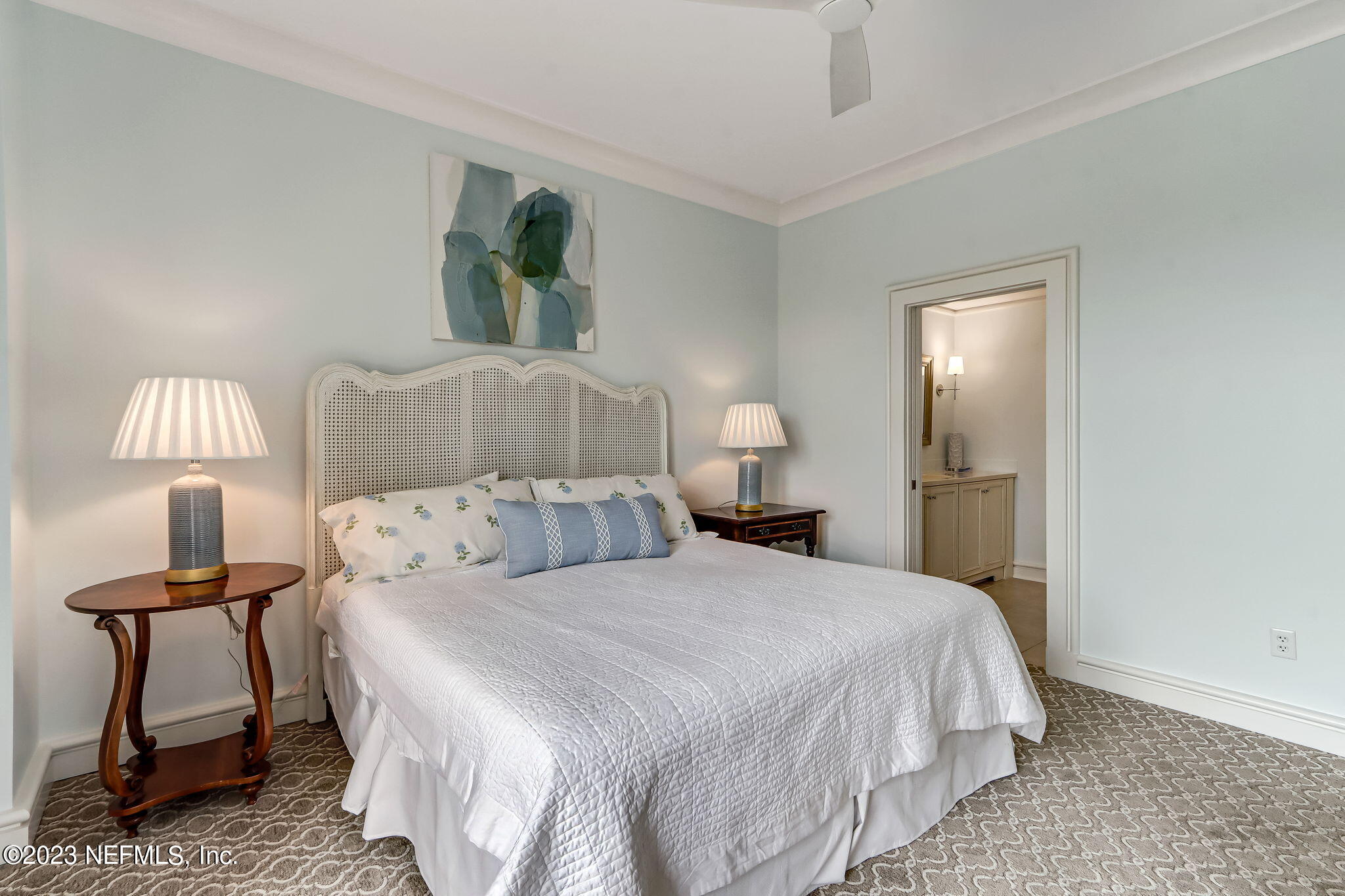 2358 Riverside Avenue, Unit 401 Jacksonville, FL 32204 - Photo 56 of 92 a bedroom with a bed and a lamp