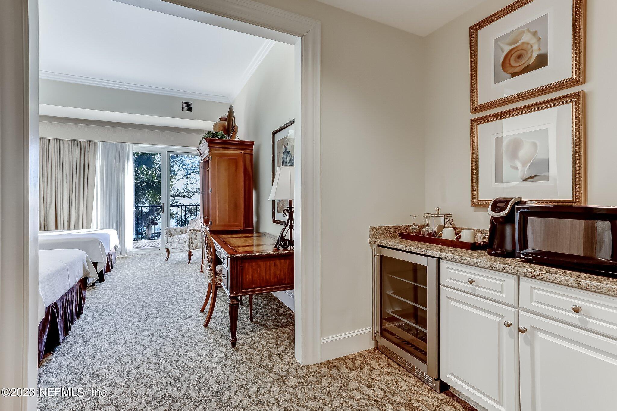 2358 Riverside Avenue, Unit 401 Jacksonville, FL 32204 - Photo 71 of 92 a view of a hallway with workspace and mirror