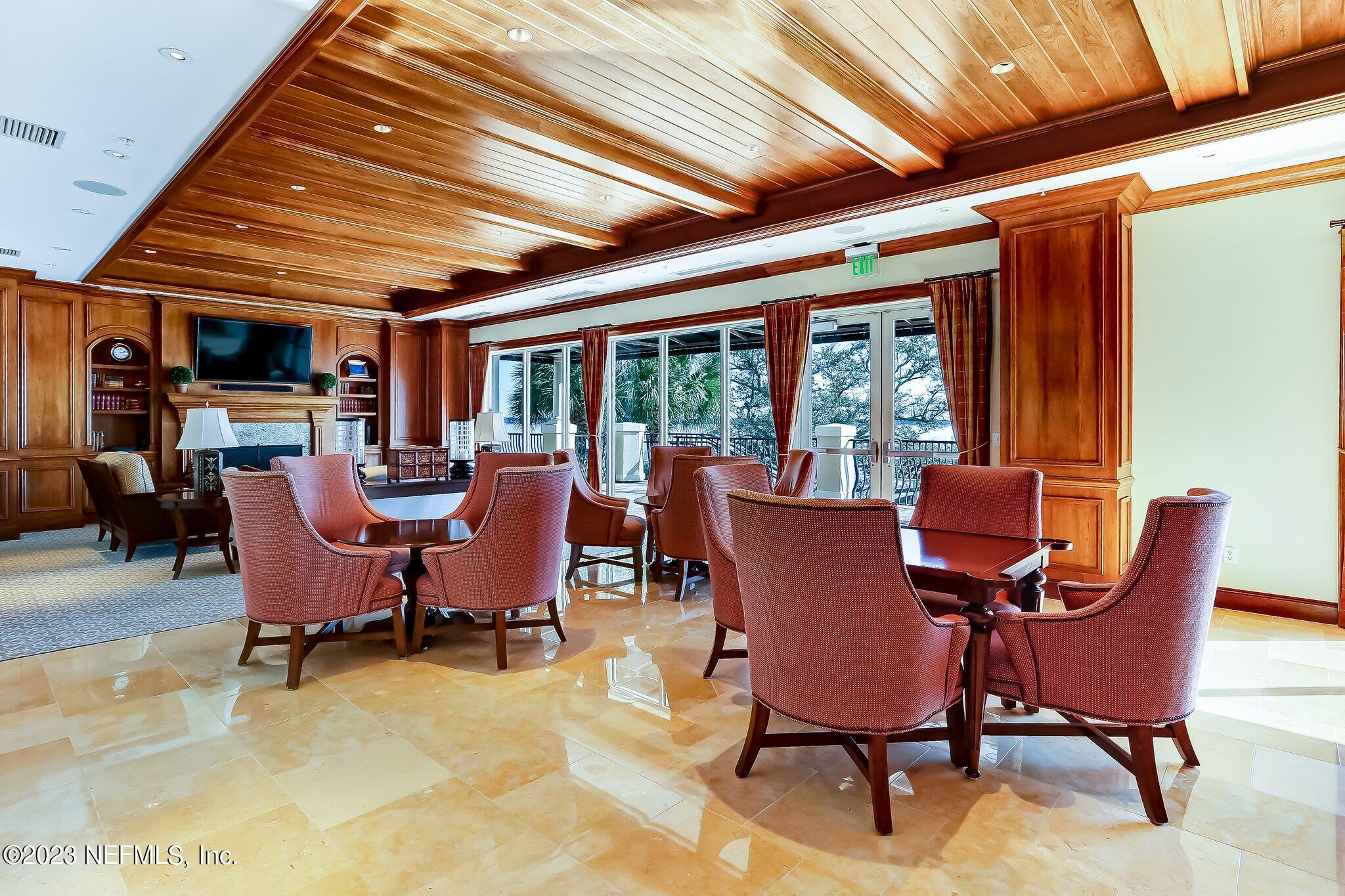 2358 Riverside Avenue, Unit 401 Jacksonville, FL 32204 - Photo 75 of 92 a dining room with furniture water view and a fireplace