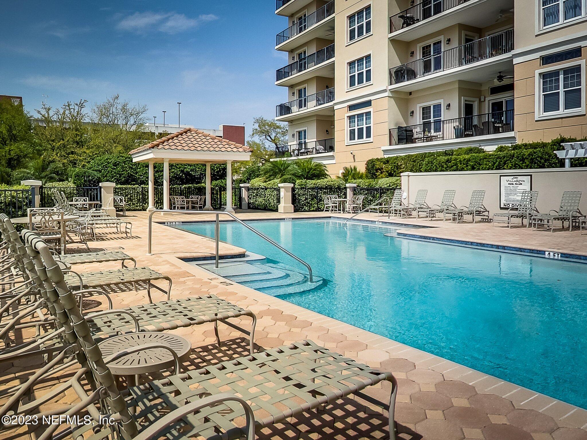 2358 Riverside Avenue, Unit 401 Jacksonville, FL 32204 - Photo 85 of 92 a patio with water view and large trees