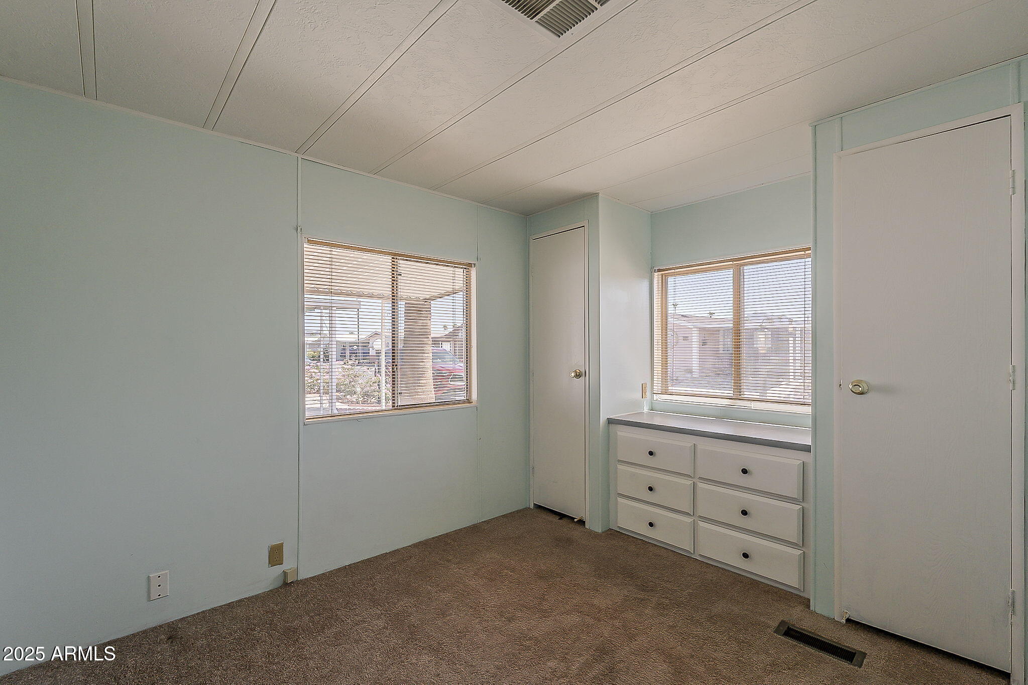 834 South Meridian Road, Unit 118 Apache Junction, AZ 85120 - Photo 31 of 50 an empty room with windows