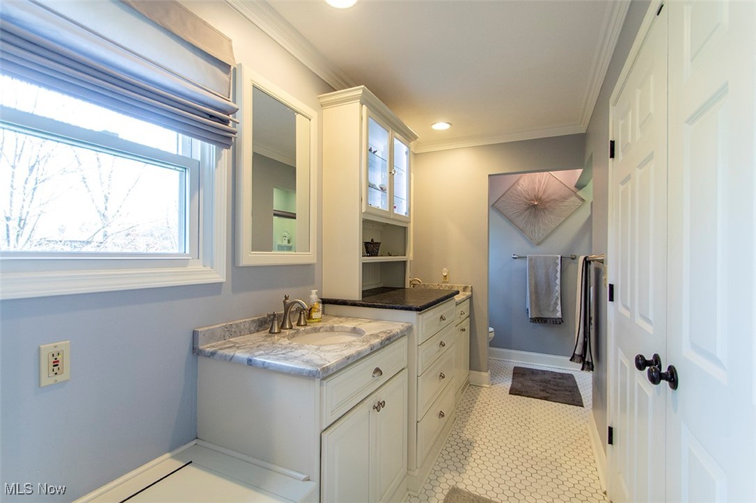 4041 Huffman Road Medina, OH 44256 - Photo 20 of 40 Bathroom with tile patterned flooring, vanity, toilet, and ornamental molding