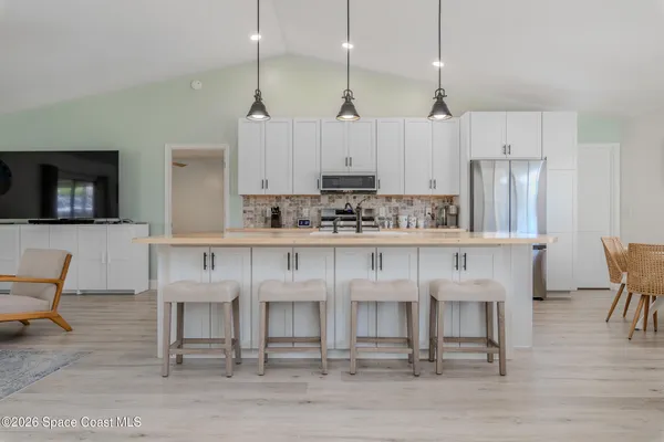 a stove sitting inside of a kitchen with granite countertop