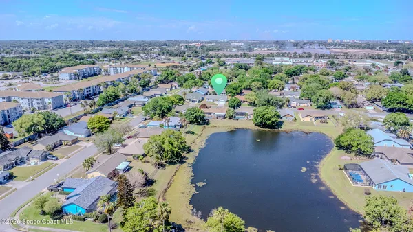an aerial view of a city with lots of residential buildings