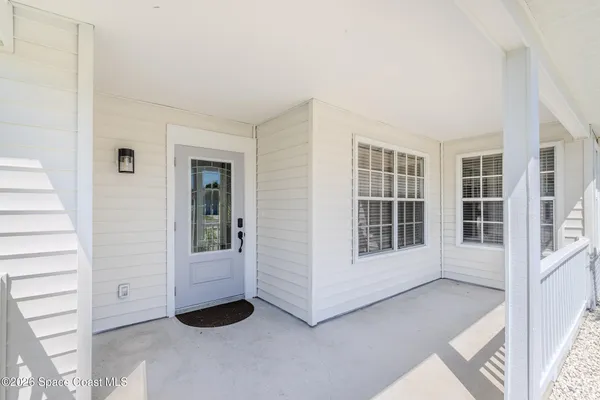 a view of a hallway with wooden floor and a fireplace