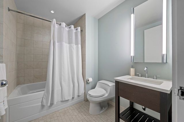 a bathroom with a toilet a sink and a bathtub