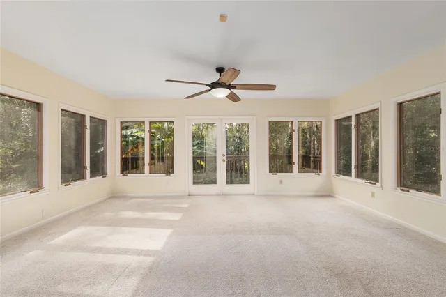 a view of an empty room with a large window