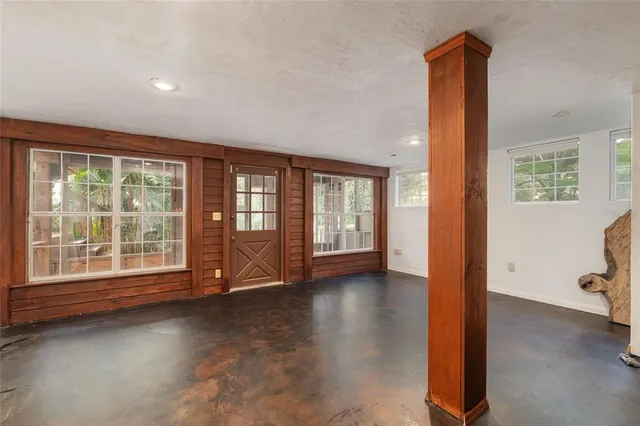 a balcony with wooden floor and fence