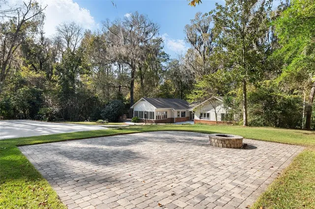 a view of a swimming pool with a yard
