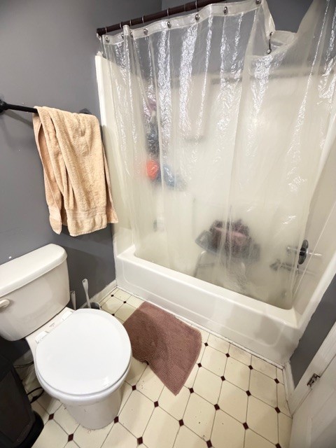 2575 Spur Road Decherd, TN 37324 - Photo 12 of 18 a bathroom with a toilet and a shower
