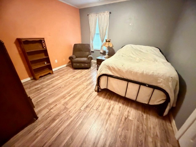 2575 Spur Road Decherd, TN 37324 - Photo 14 of 18 a bedroom with furniture and wooden floor