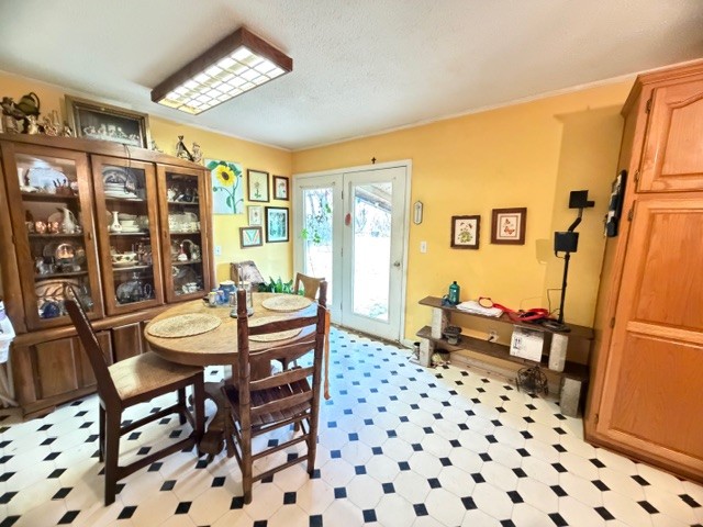 2575 Spur Road Decherd, TN 37324 - Photo 7 of 18 a dining room with furniture a rug a flat screen tv and a large window