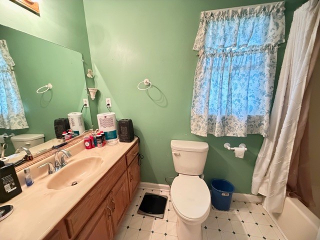 2575 Spur Road Decherd, TN 37324 - Photo 9 of 18 a bathroom with a toilet sink and mirror