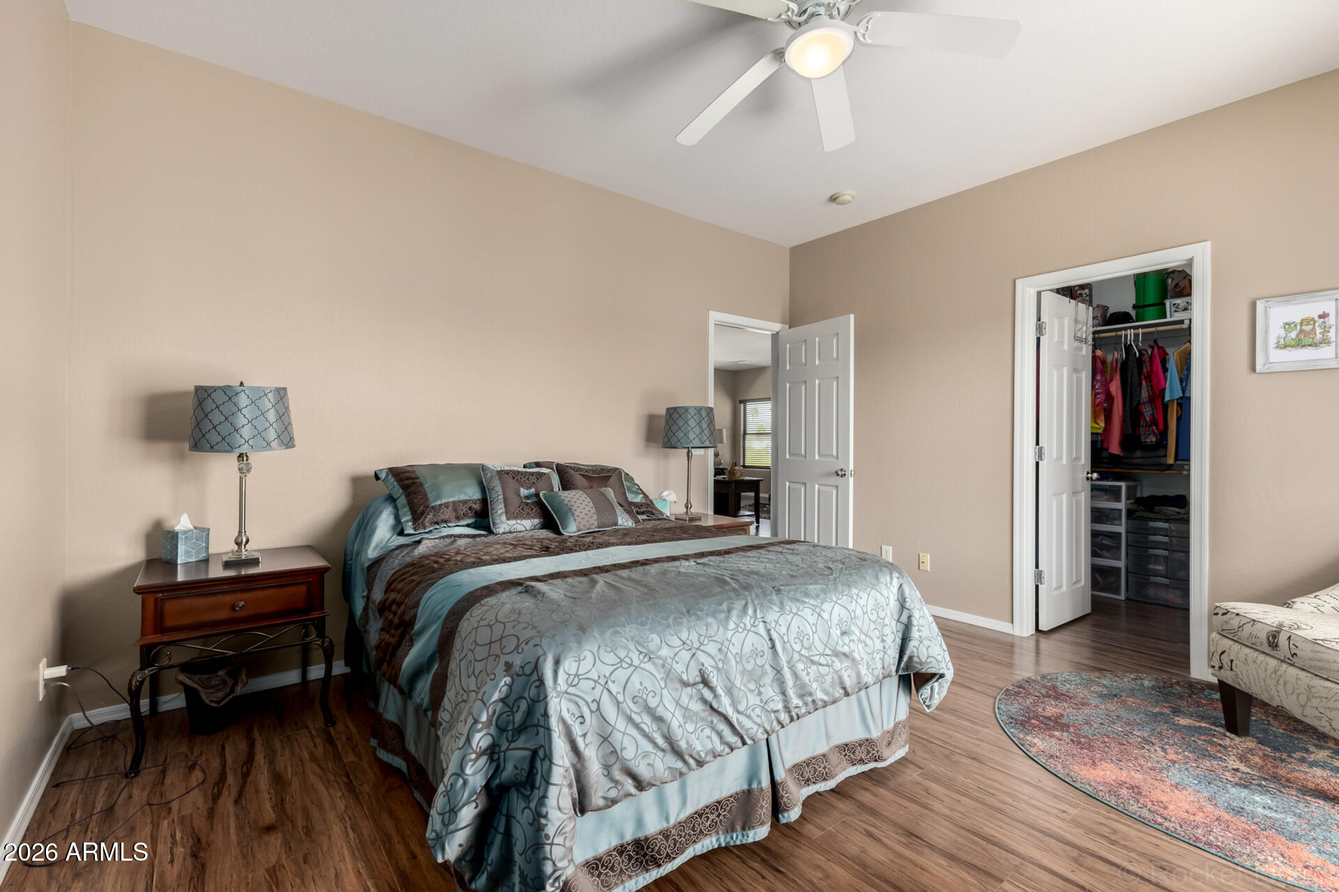 2756 South Powell Road Apache Junction, AZ 85119 - Photo 13 of 37 a bedroom with a bed and a chandelier