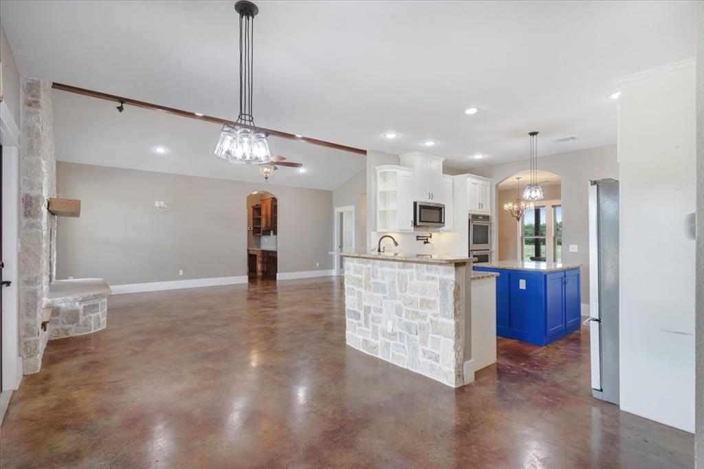 516 Springtown Road Van Alstyne, TX 75495 - Photo 16 of 40 a view of a living room and chandelier