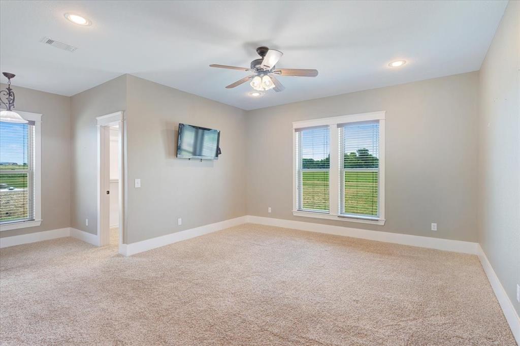 516 Springtown Road Van Alstyne, TX 75495 - Photo 18 of 40 a view of a livingroom with a ceiling fan and window