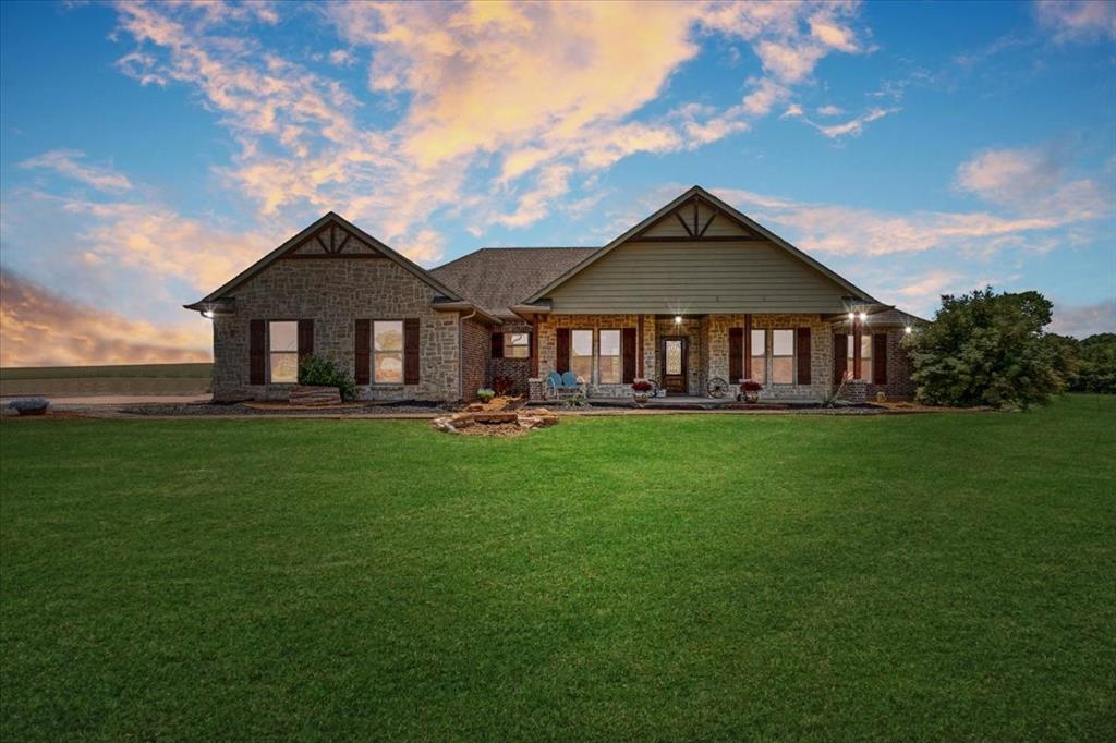 516 Springtown Road Van Alstyne, TX 75495 - Photo 2 of 40 a front view of a house with a yard