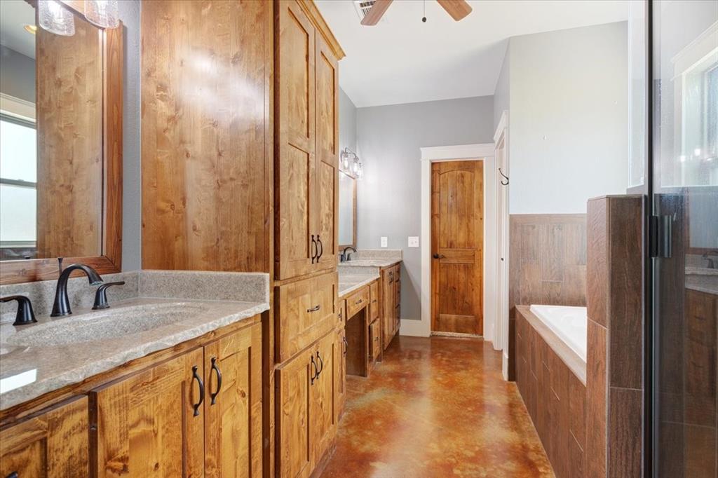 516 Springtown Road Van Alstyne, TX 75495 - Photo 21 of 40 a bathroom with a sink a mirror and a shower