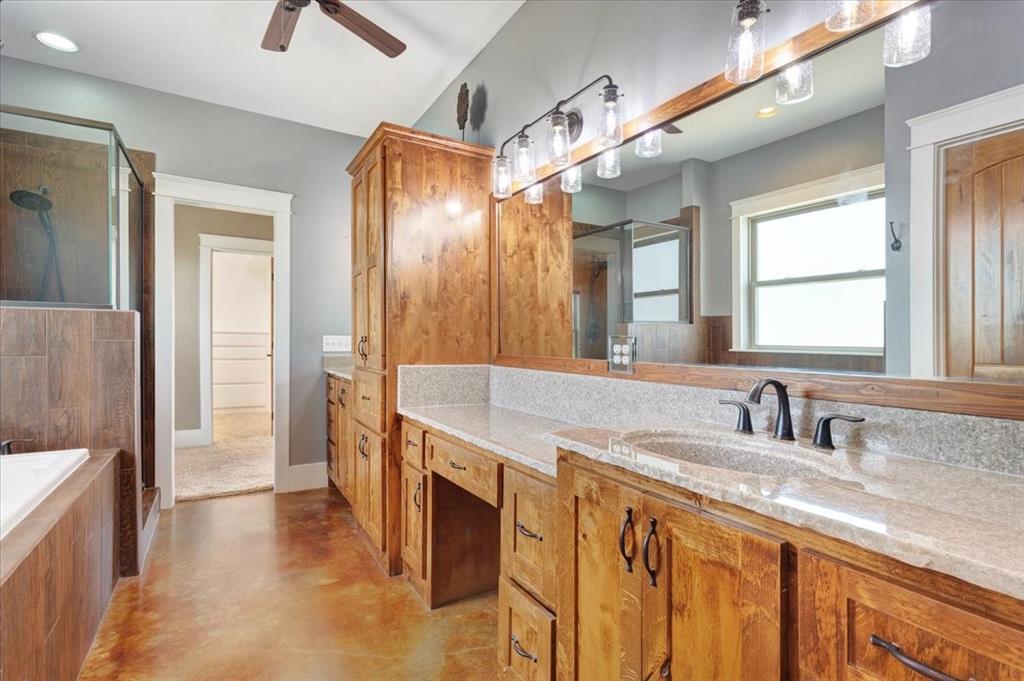 516 Springtown Road Van Alstyne, TX 75495 - Photo 22 of 40 a bathroom with a sink and a mirror