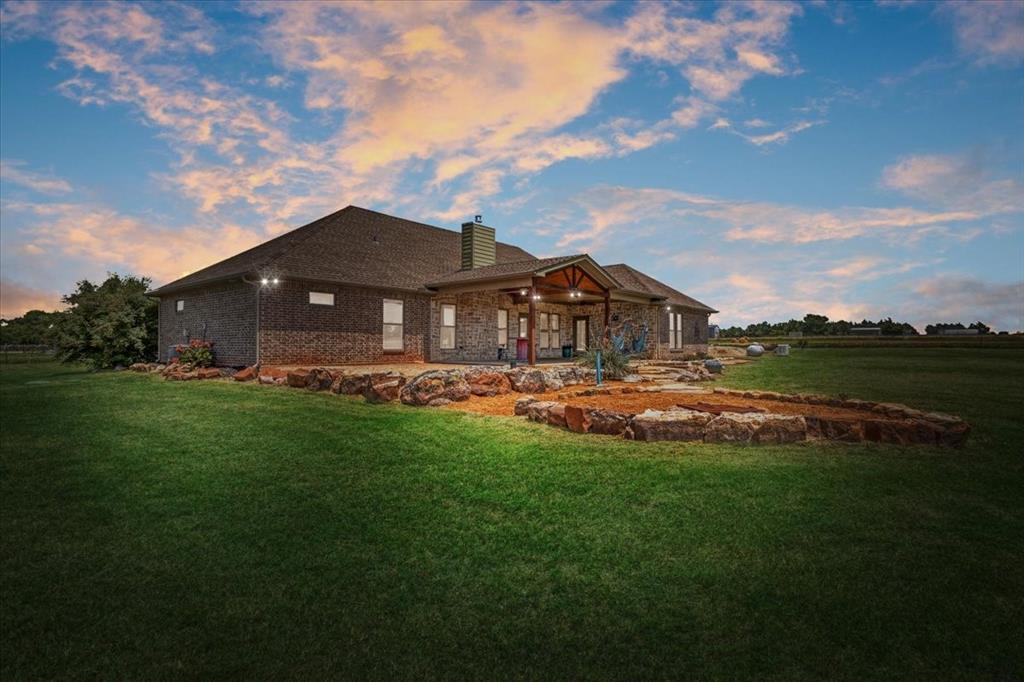 516 Springtown Road Van Alstyne, TX 75495 - Photo 3 of 40 a view of a house with a big yard