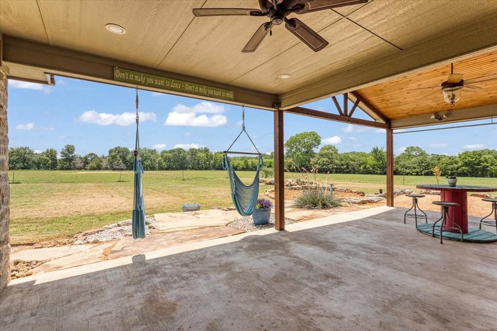 516 Springtown Road Van Alstyne, TX 75495 - Photo 34 of 40 a view of a building with a ocean from a ceiling fan