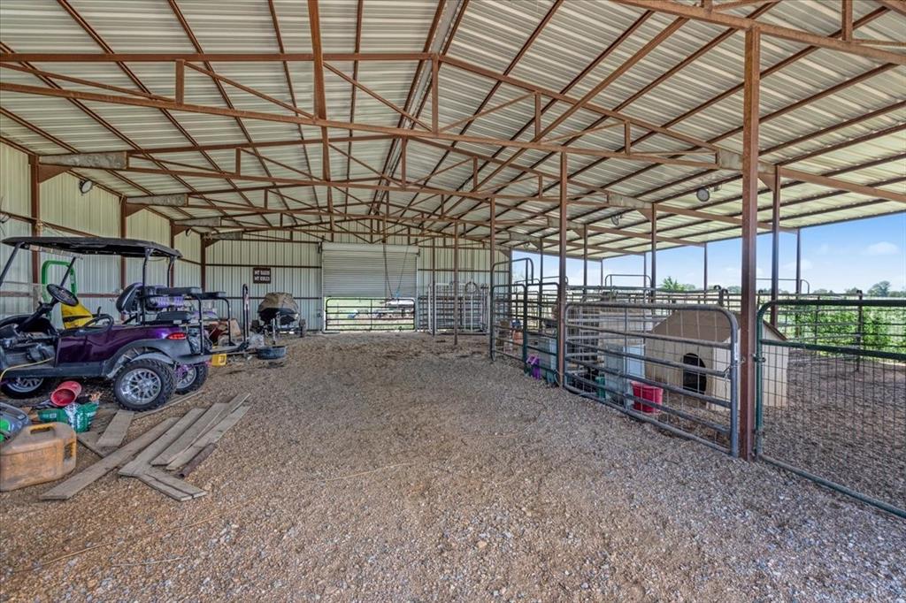 516 Springtown Road Van Alstyne, TX 75495 - Photo 36 of 40 a view of a garage with parked cars