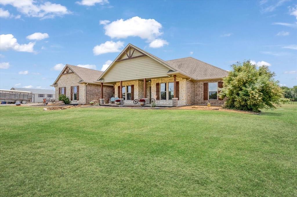 516 Springtown Road Van Alstyne, TX 75495 - Photo 5 of 40 a front view of house with yard and green space