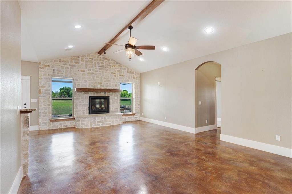 516 Springtown Road Van Alstyne, TX 75495 - Photo 7 of 40 an empty room with windows and a fireplace