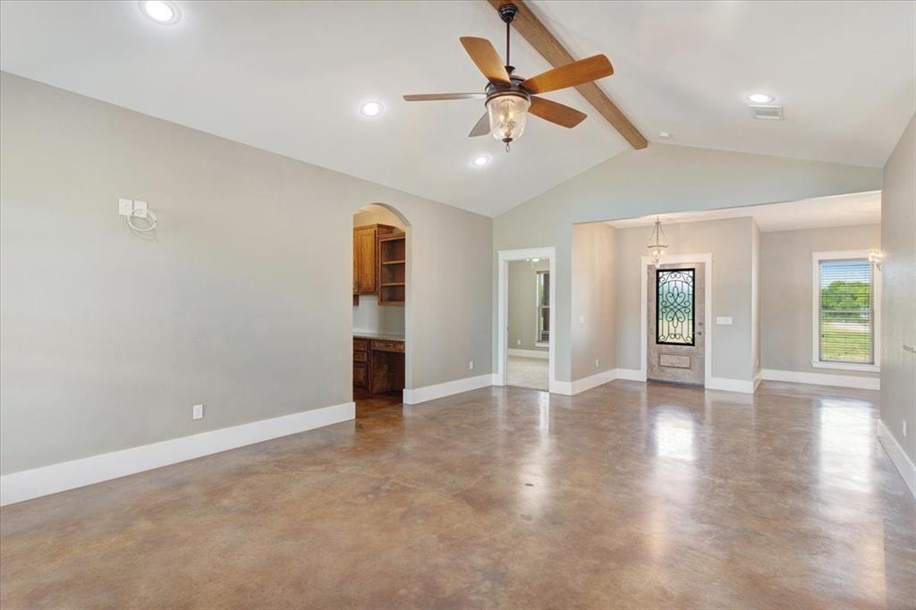516 Springtown Road Van Alstyne, TX 75495 - Photo 9 of 40 a view of an empty room with window and wooden floor