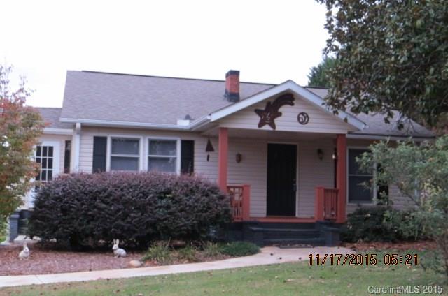 4020 Polk County Line Road Rutherfordton, NC 28139 - Photo 1 of 18 a front view of a house with garden