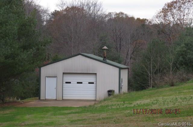 4020 Polk County Line Road Rutherfordton, NC 28139 - Photo 2 of 18 a house with green field in front of it