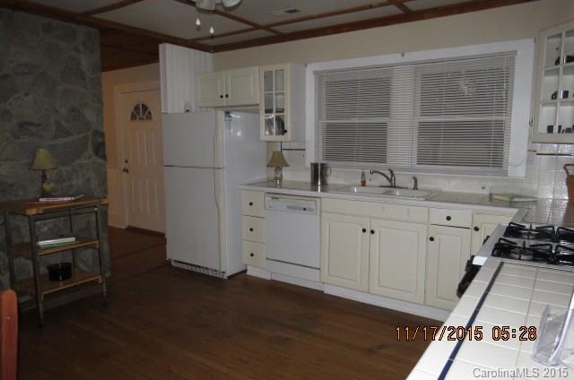 4020 Polk County Line Road Rutherfordton, NC 28139 - Photo 11 of 18 a kitchen with a sink stove and refrigerator