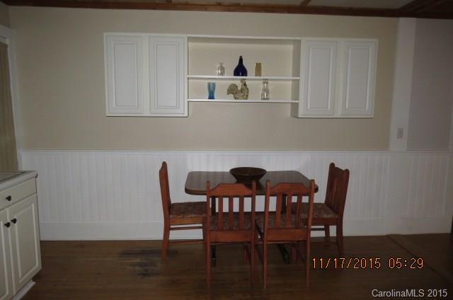 4020 Polk County Line Road Rutherfordton, NC 28139 - Photo 12 of 18 a view of a dining room with furniture and wooden floor