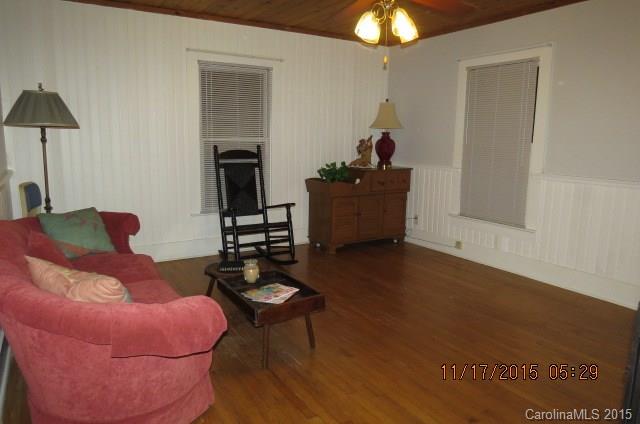 4020 Polk County Line Road Rutherfordton, NC 28139 - Photo 14 of 18 a living room with furniture and a chandelier