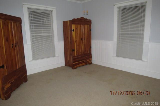 4020 Polk County Line Road Rutherfordton, NC 28139 - Photo 15 of 18 an empty room with wooden floor and windows
