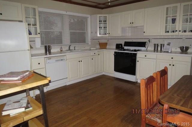 4020 Polk County Line Road Rutherfordton, NC 28139 - Photo 18 of 18 a kitchen with stainless steel appliances cabinets a sink and a refrigerator