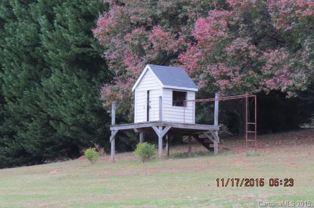 4020 Polk County Line Road Rutherfordton, NC 28139 - Photo 4 of 18 a backyard of a house with table and chairs