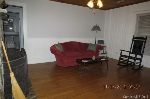 4020 Polk County Line Road Rutherfordton, NC 28139 - Photo 7 of 18 a living room with furniture and a chandelier