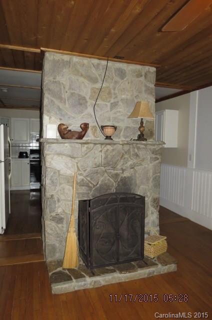 4020 Polk County Line Road Rutherfordton, NC 28139 - Photo 9 of 18 a stove top oven sitting inside of a kitchen