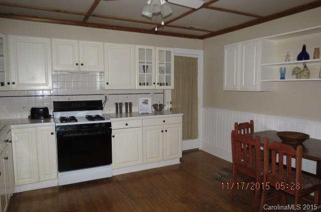 4020 Polk County Line Road Rutherfordton, NC 28139 - Photo 10 of 18 a kitchen with stainless steel appliances granite countertop a stove and cabinets