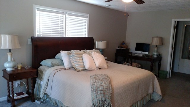 7808 Whittle Road Macon, GA 31220 - Photo 11 of 20 a bedroom with a bed and a window