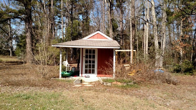 7808 Whittle Road Macon, GA 31220 - Photo 12 of 20 a front view of a house with a garden