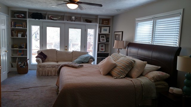 7808 Whittle Road Macon, GA 31220 - Photo 16 of 20 a bedroom with a large bed and a couch