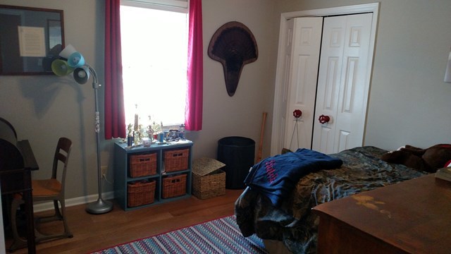 7808 Whittle Road Macon, GA 31220 - Photo 18 of 20 a bedroom with a bed and a window
