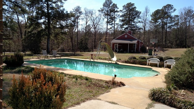 7808 Whittle Road Macon, GA 31220 - Photo 4 of 20 a view of a house with pool yard and a wooden deck