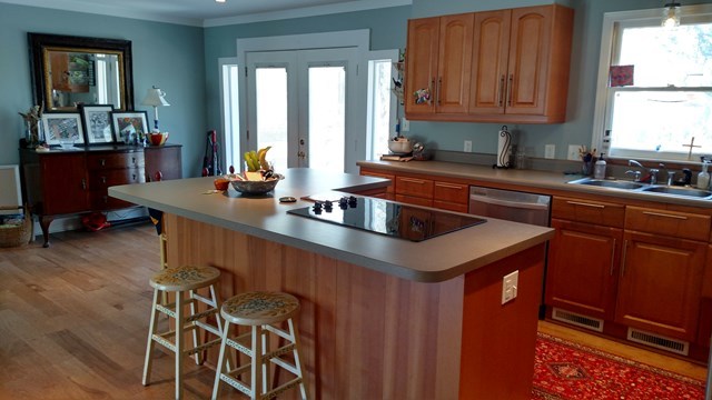 7808 Whittle Road Macon, GA 31220 - Photo 5 of 20 a kitchen with stainless steel appliances granite countertop a sink and a refrigerator