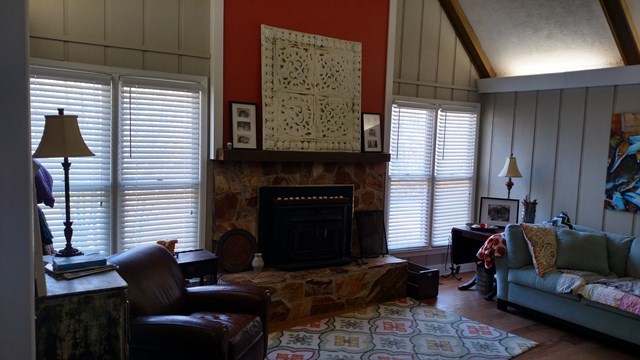 7808 Whittle Road Macon, GA 31220 - Photo 8 of 20 a living room with furniture a window and a fireplace