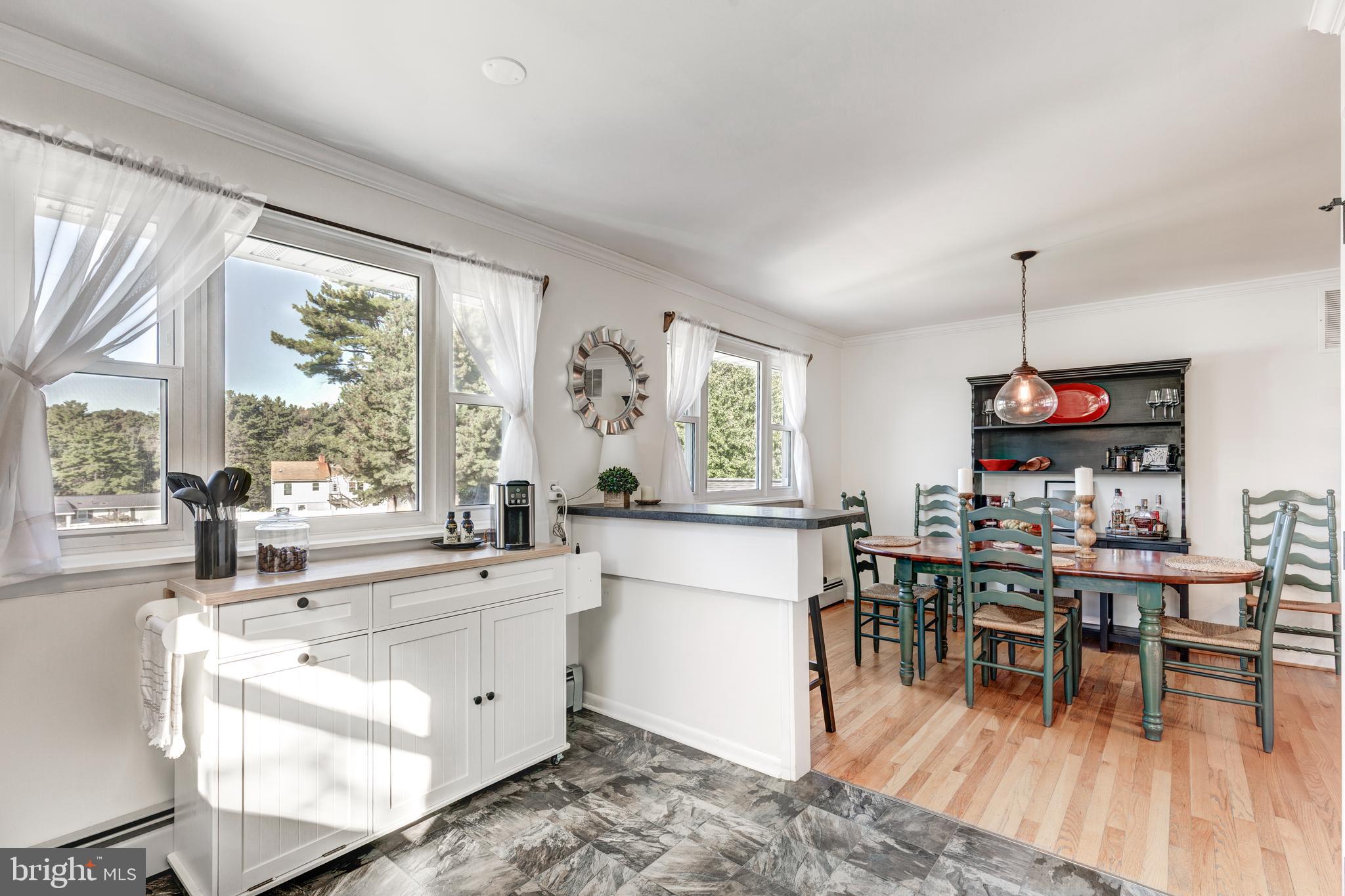 2108 Hanover Pike Hampstead, MD 21074 - Photo 11 of 51 a living room with furniture a dining table and a large window
